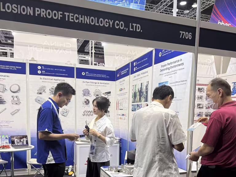 shenhai explosion-proof sales team communicating with clients at oga 2026 booth 7706